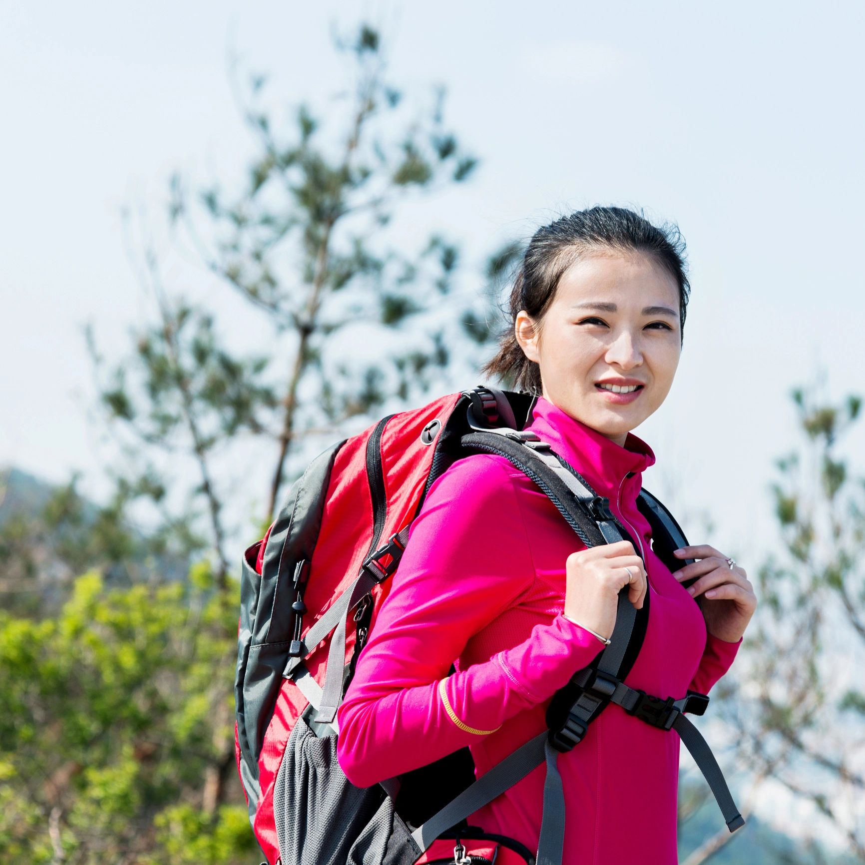 Portrait of a smiling backpacker outdoors