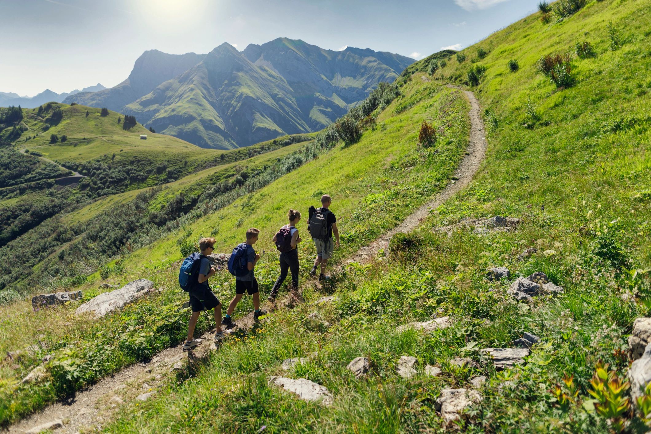 Hikers on an alpine trail in the mountains