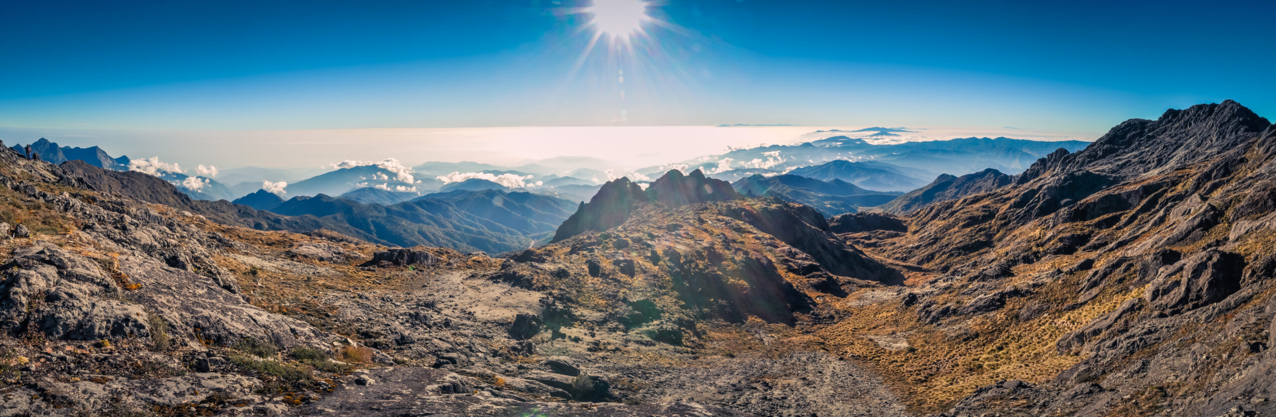 Mount Wilhelm 4,509 meter summit in Papua New Guinea, showing the tropical alpine character of the mountain that requires neither technical climbing equipment nor specialized mountaineering gear, but does require a versatile layering system spanning warm tropical rain to sub-freezing summit-zone conditions