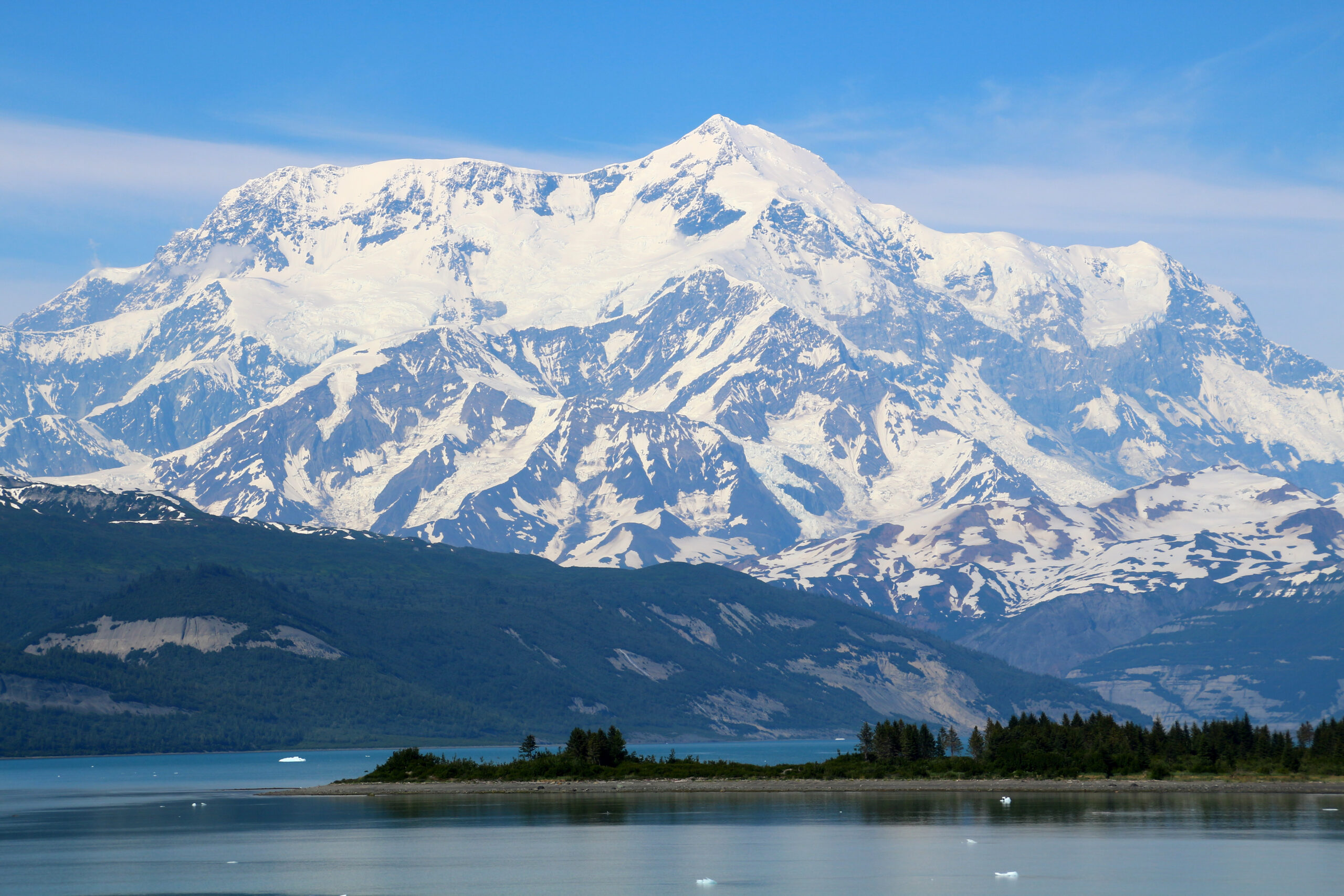 Mount Saint Elias at 18008 feet on the Alaska Yukon border showing the dramatic 5489 meter glaciated summit rising directly from the Gulf of Alaska coast in the Saint Elias Mountains during 2026 climbing season