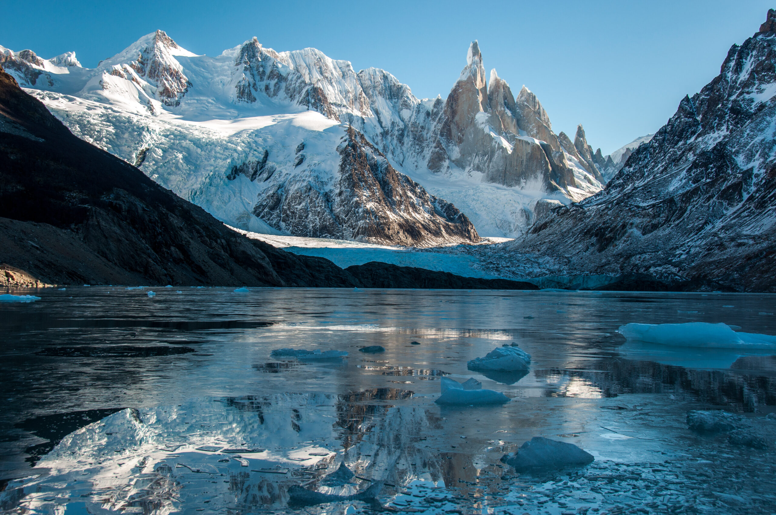 Cerro Torre's 3,128-meter granite spire viewed from the Patagonian Ice Field &mdash; the mountain's near-vertical rock walls combined with the summit rime ice mushroom create the unique technical demands that have caused fatalities across 80 years of climbing history, from Toni Egger's 1959 death through Korra Pesce's 2022 rime ice collapse
