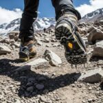 Climbers wearing mountaineering boots on rocky terrain, highlighting footwear for Aconcagua expeditions