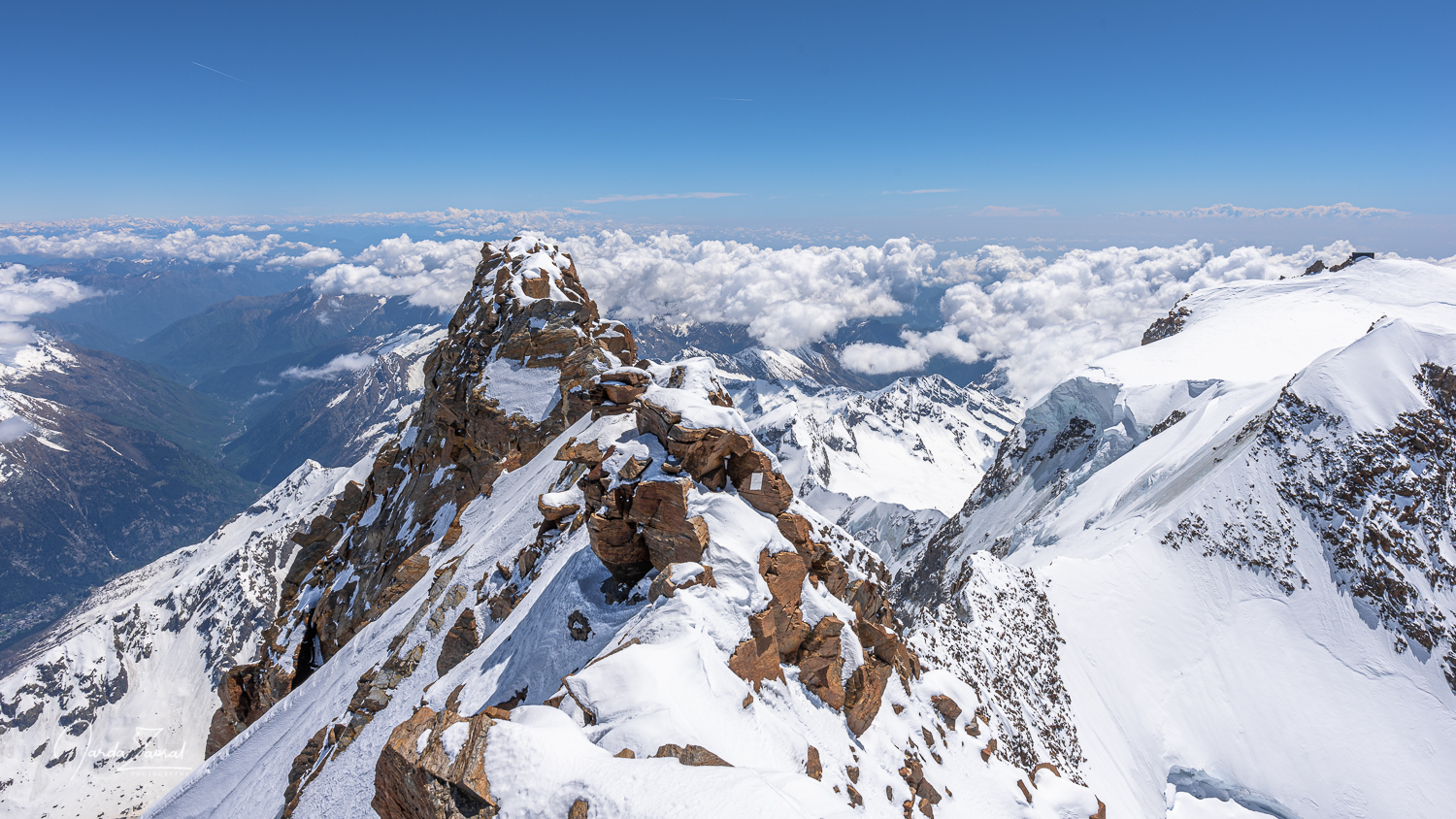 Dufourspitze summit at 4634 meters in the Monte Rosa massif on the Swiss-Italian border showing snow-covered peaks and rocky ridges of the high-alpine environment — Switzerland's highest mountain and the second highest in the Alps after Mont Blanc, first climbed 1 August 1855 by the Smyth-Hudson-Taugwalder party