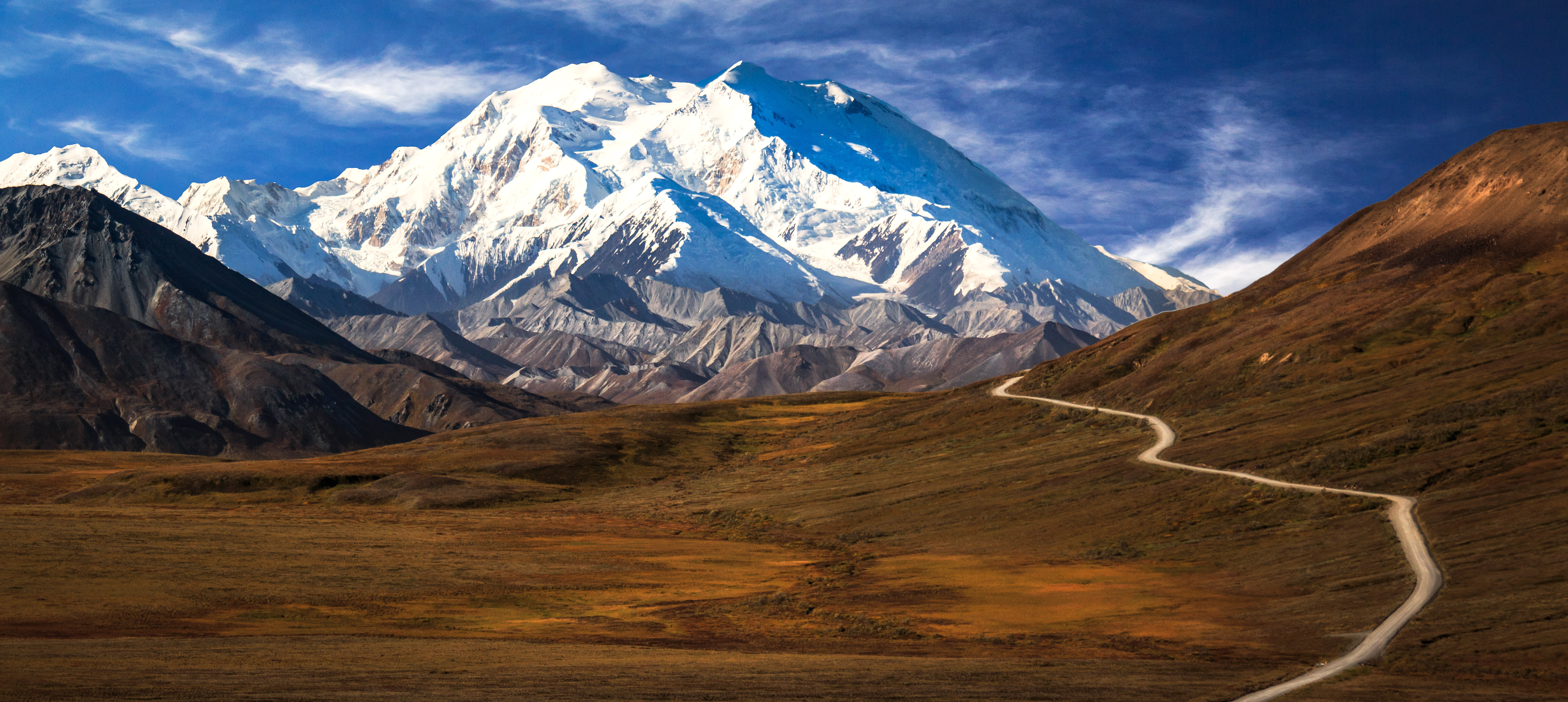 Denali mountain peak and winding trail, Alaska expedition landscape