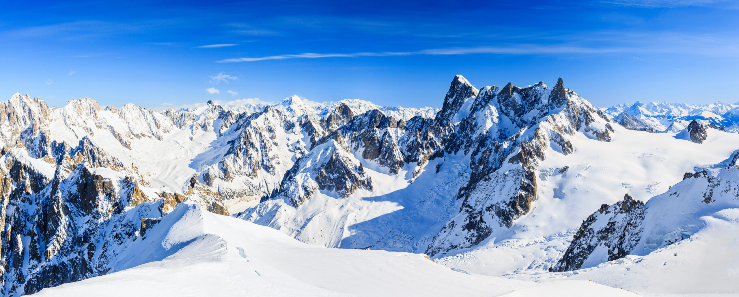 Snow-covered Mont Blanc mountain range and peaks, technical routes for alpinists