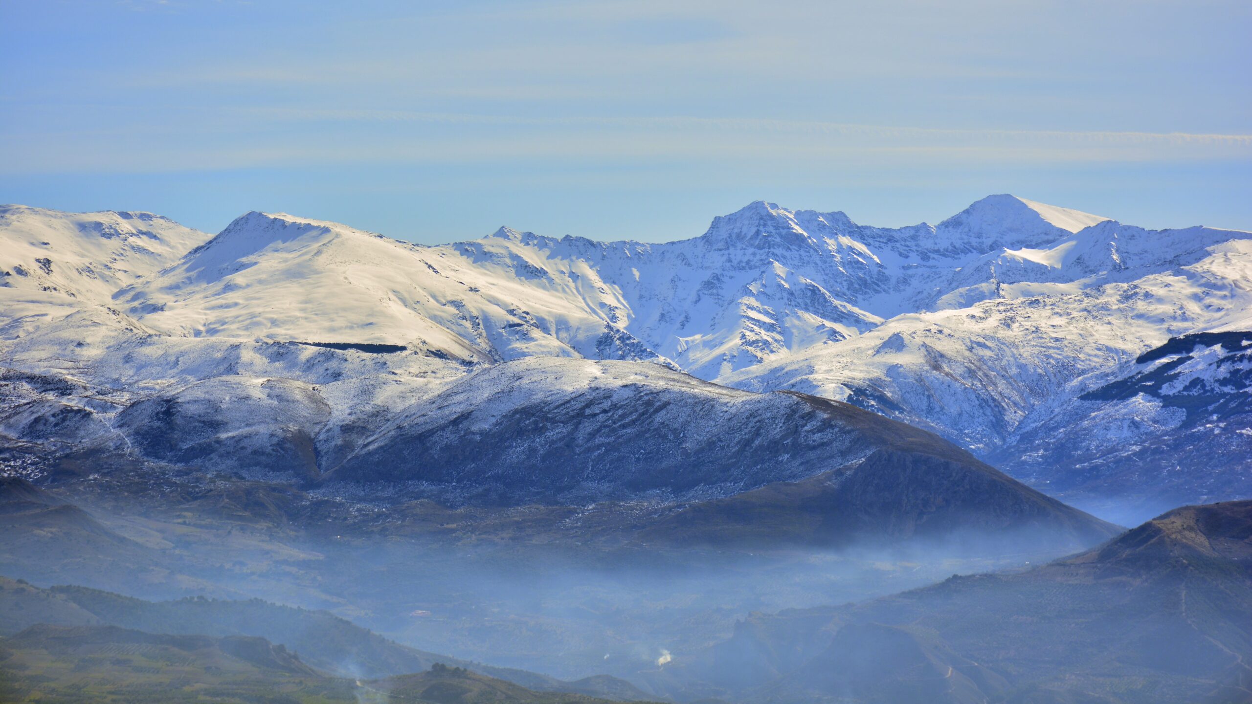 Mount Mulhacén the highest peak in Spain at 3479 meters in the Sierra Nevada range Andalusia showing the dramatic summit landscape that climbers experience when reaching the highest point on the Iberian Peninsula