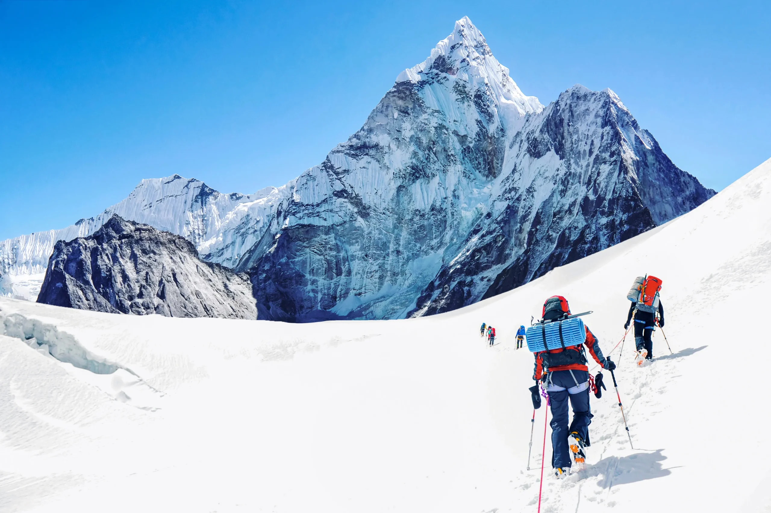 Climber using GPS and map on a mountain trail, highlighting navigation tools for climbing