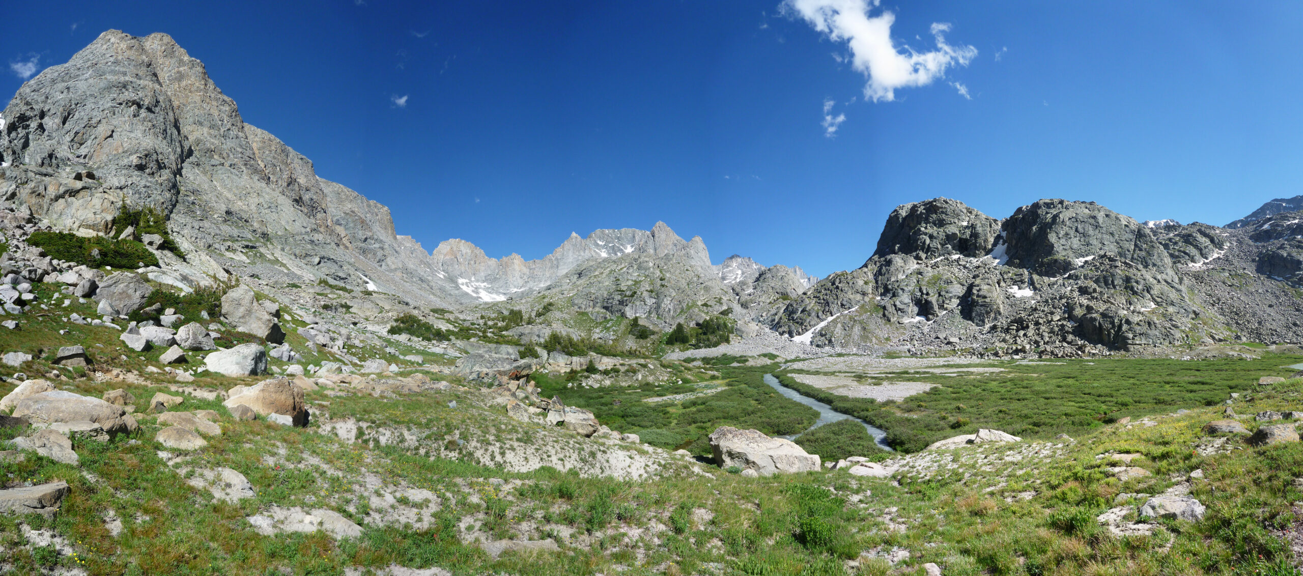 Gannett Peak and Wind River Range, Wyoming's highest mountain, under a clear blue sky.