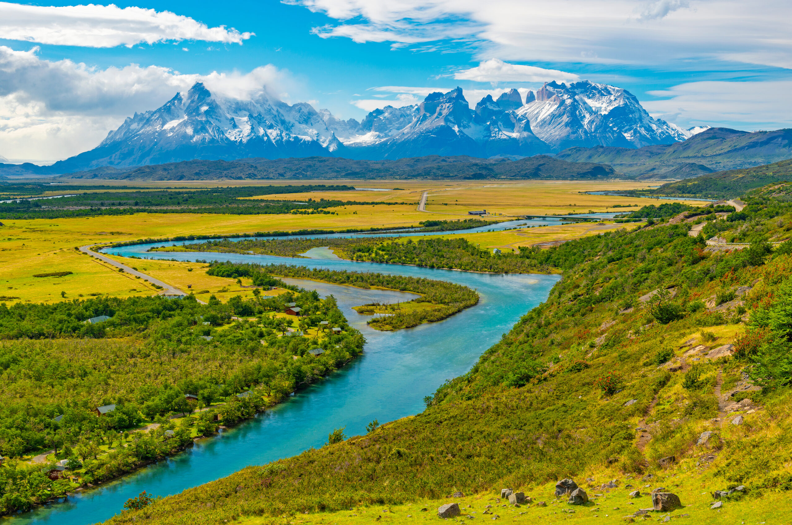 Cuernos del Paine peaks and Serrano River in Torres del Paine National Park, Patagonia landscape.