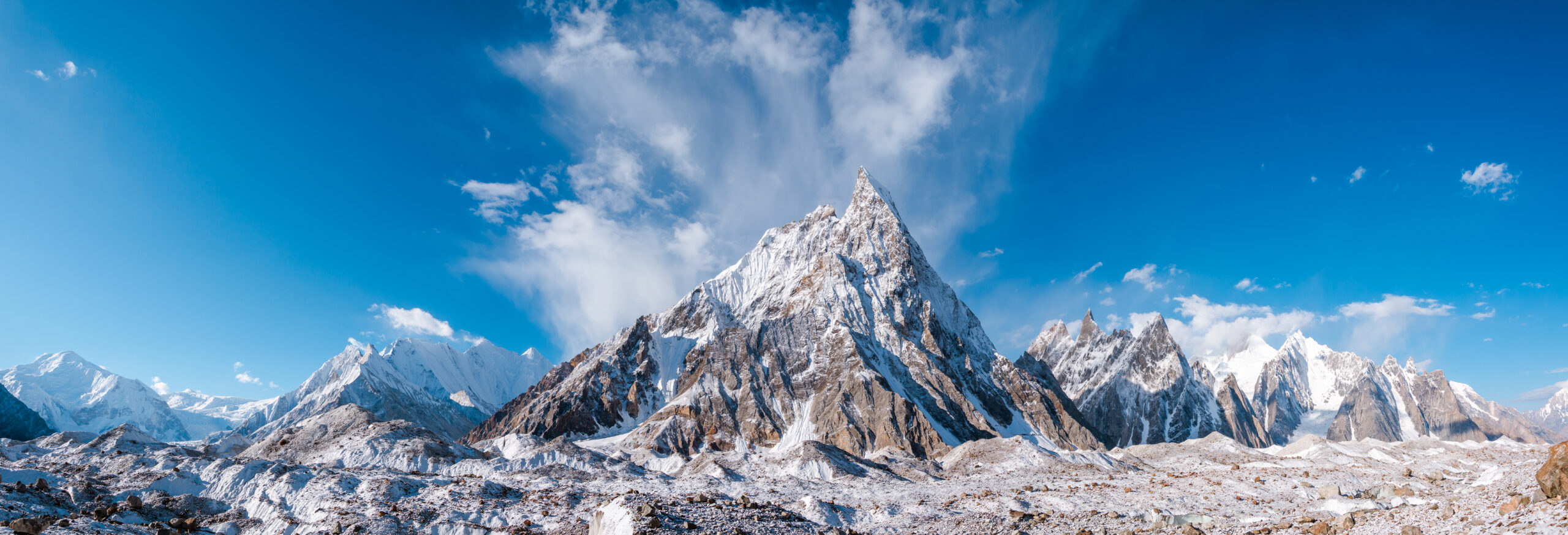 K2 rising above the surrounding Karakoram Range in Pakistan beneath a clear blue sky