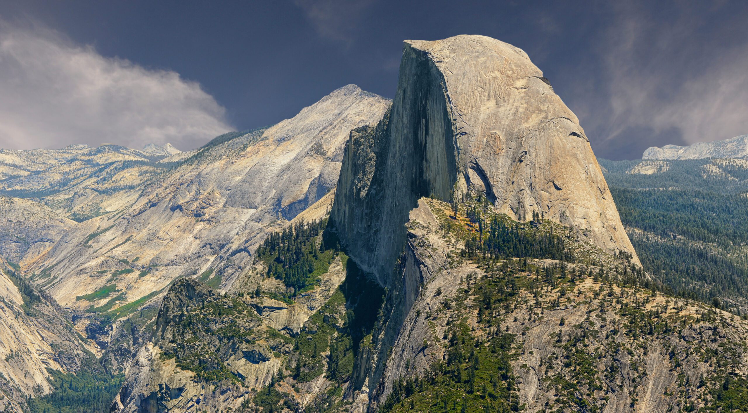 California Sierra Nevada granite landscape representing the dramatic high-country terrain that characterizes both Half Dome in Yosemite National Park and Mount Whitney in the eastern Sierra showing the kind of granite massif and alpine setting that defines California's two most iconic day hike objectives with the comparison between them serving as the central question California hikers ask when planning their bucket-list big-day hike progression