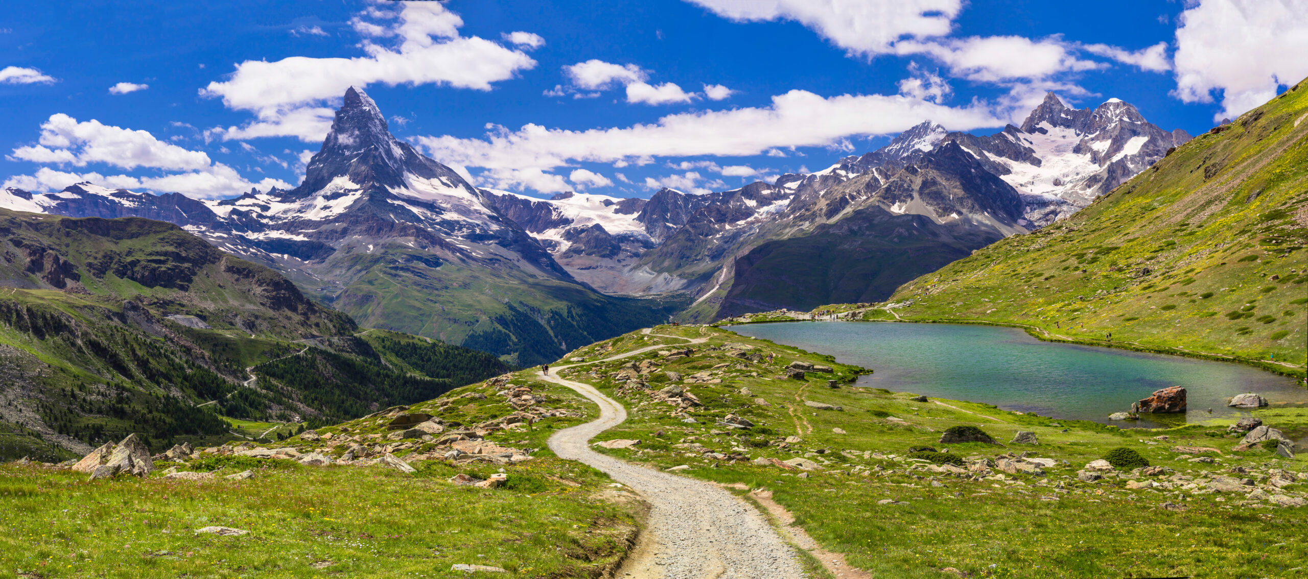 A car-free alpine village below high mountains, reached by railway