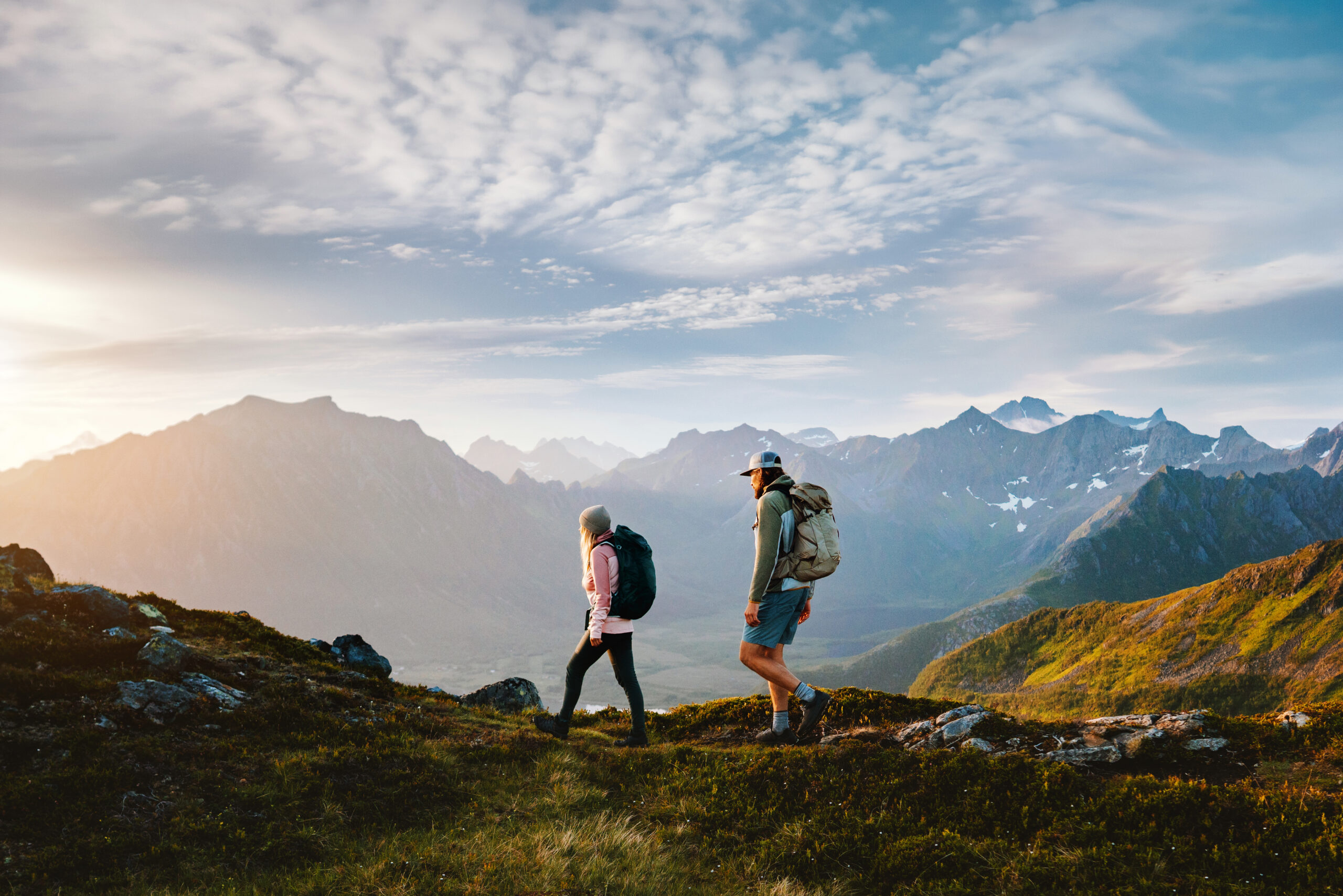 A group on a mountain trail on a clear day