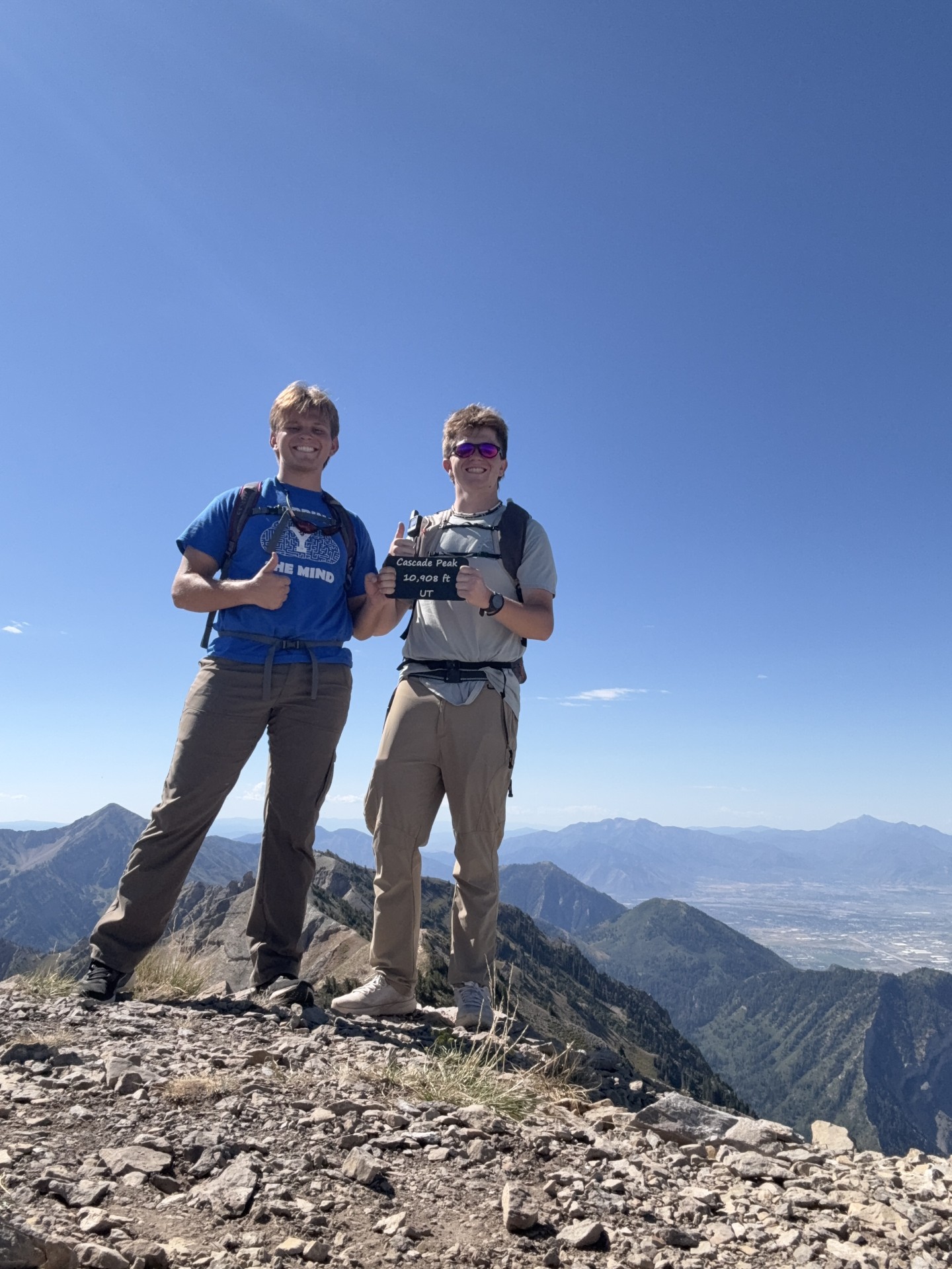 Two climbers together on the 10,908-foot summit of Cascade Mountain Utah