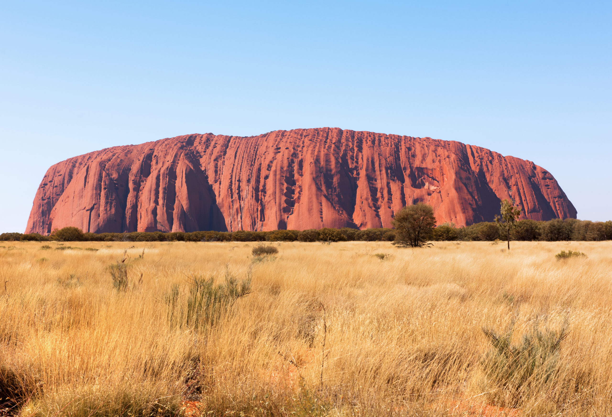 The base of Uluru with its caves, folds and waterholes along the walking track